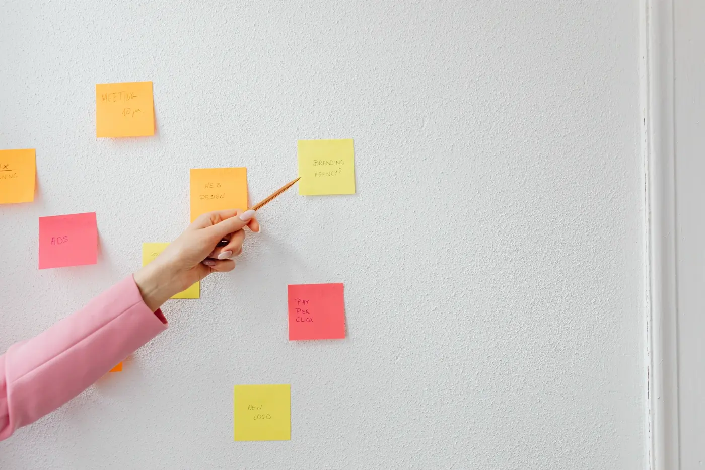 Campaign planning with ideas organised on a wall